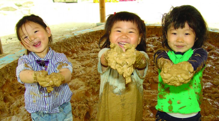 children playing in mud