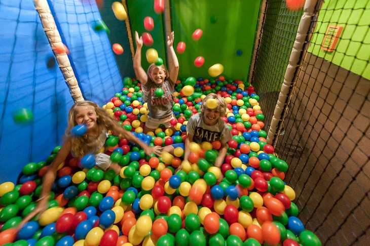 Kids help soft play places stay in business by playing at the ball pit.